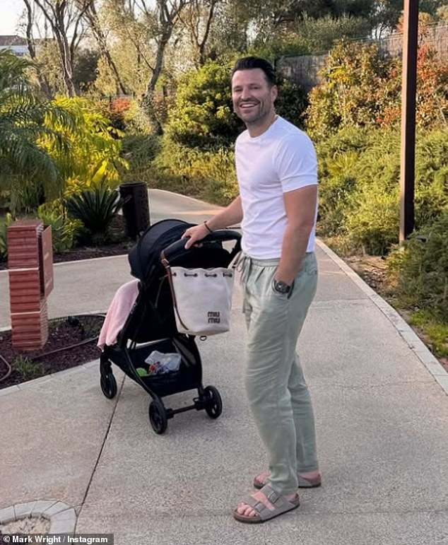 The new dad kept it casual in a white T-shirt and draw string trousers