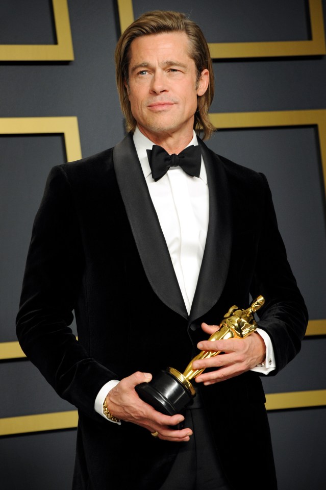 Brad Pitt holding an Oscar.