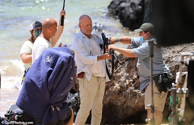 In her upcoming book The Unexpected Journey, out September 9, 2025, Heming shares intimate details about the extraordinary lengths taken to help Bruce remain in front of the camera as symptoms of frontotemporal dementia (FTD) began to take hold; (seen on set of Paradise City in 2021)
