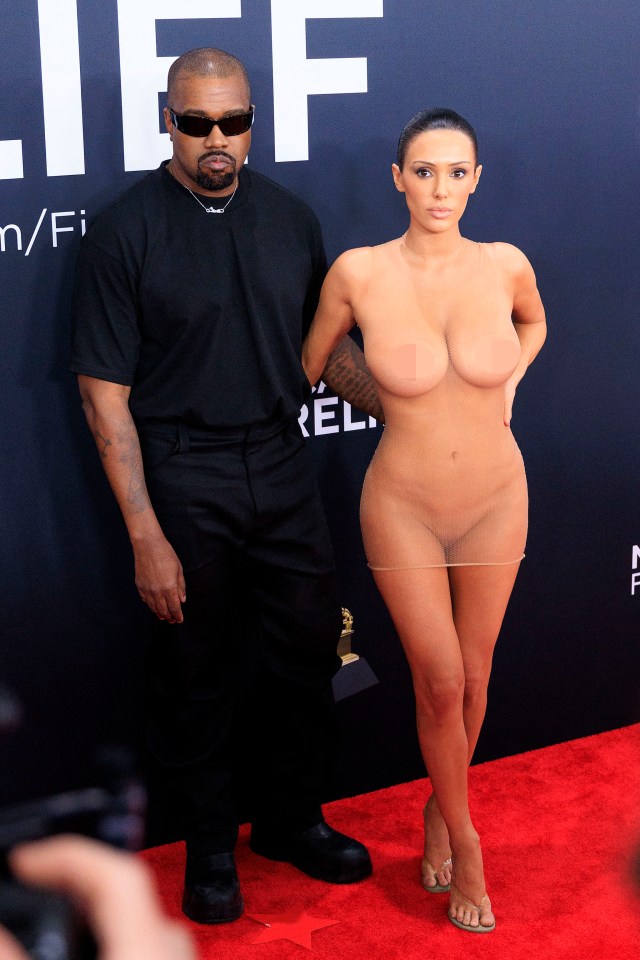 Kanye West and Bianca Censori at the Grammy Awards.  (Image contains nudity.)