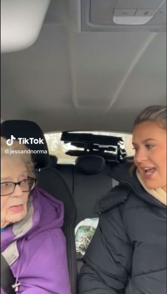 Screenshot of a TikTok video showing a young woman and an elderly woman in a car.