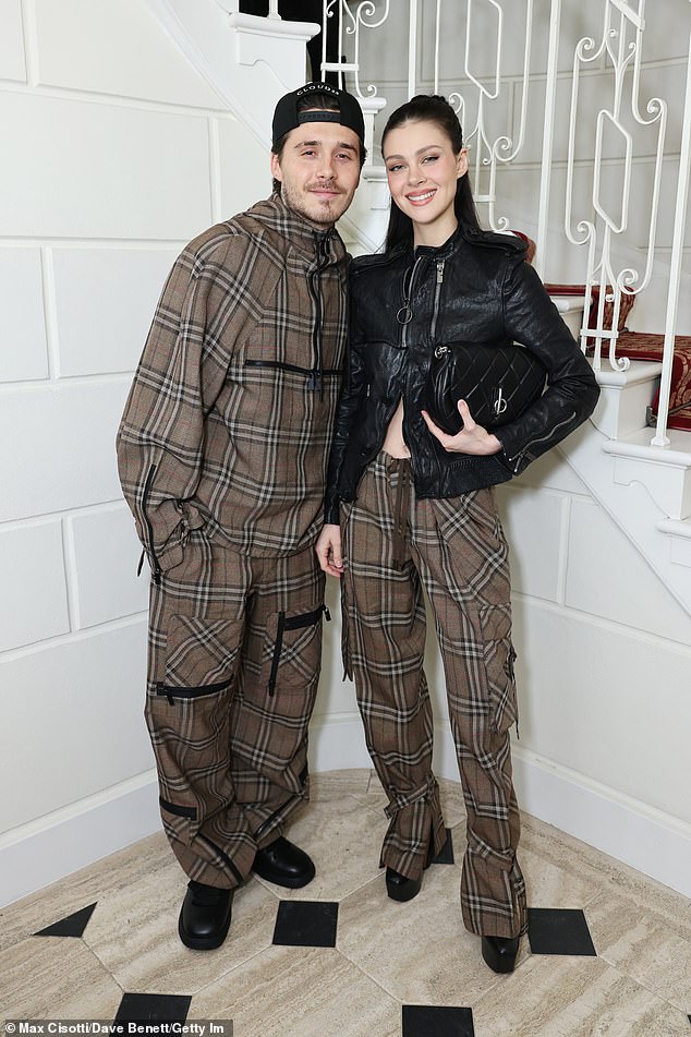 The fashion designer appeared in good spirits despite her and husband David, 50, being in the midst of an escalating rift with eldest son Brooklyn Beckham and his actress wife, Nicola Peltz
