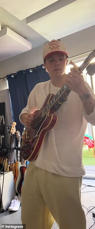 Cruz appeared happy and relaxed as he played his guitar