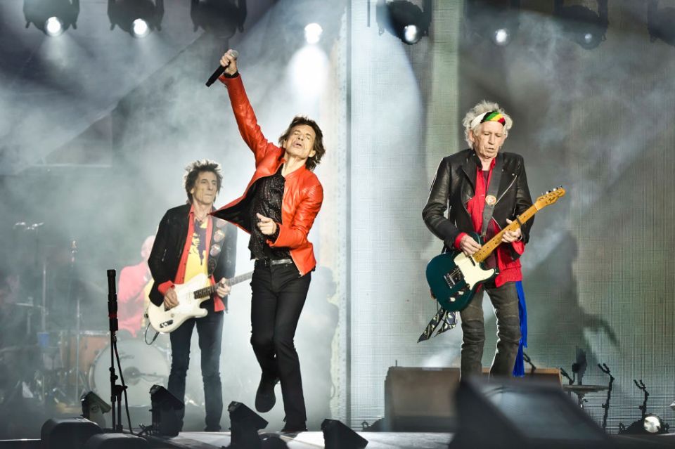 The Rolling Stones performing live on stage.