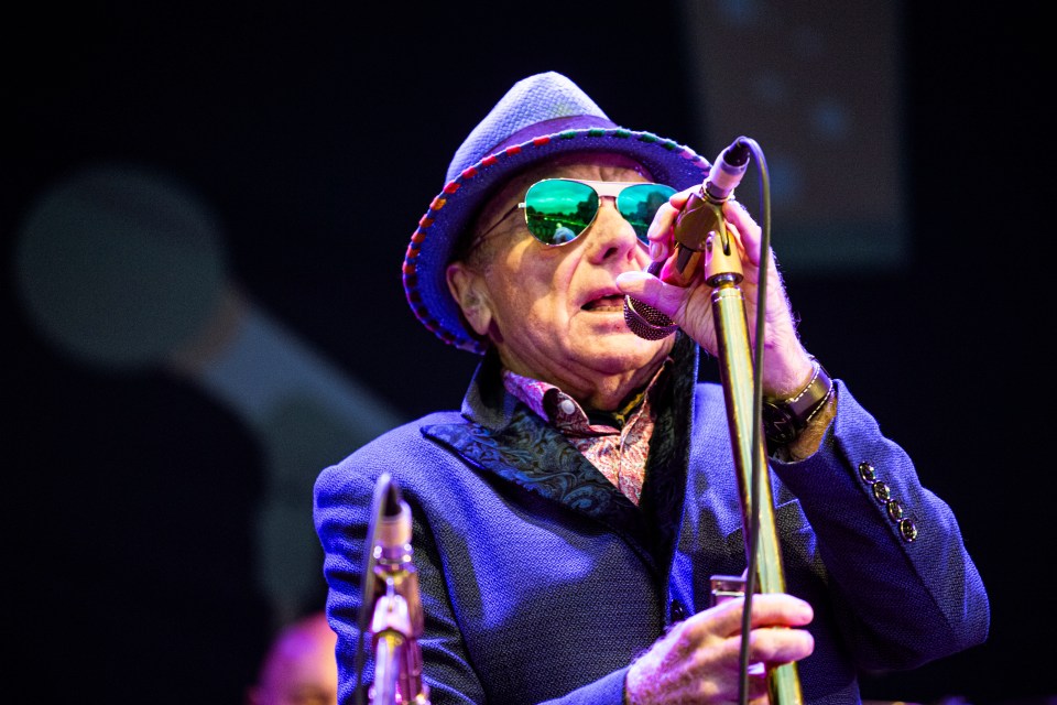 Van Morrison performing at a concert.