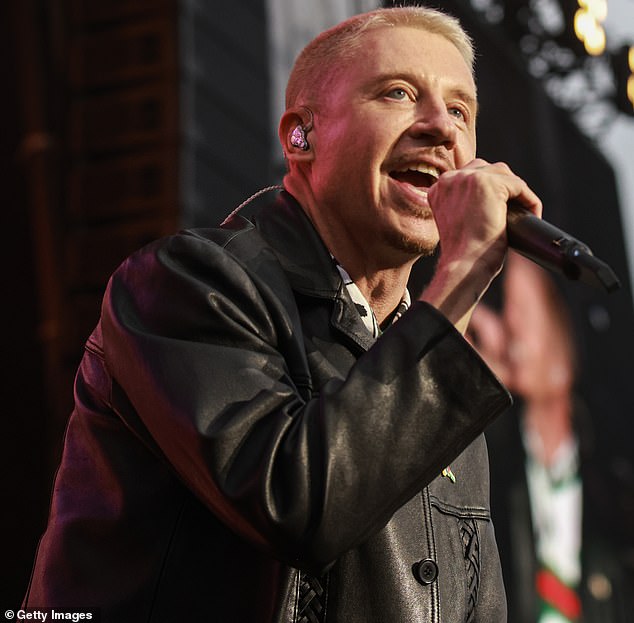 Macklemore, real name Benjamin Haggerty, was presumably out of the country at the time, as he played a concert in Frankfurt, Germany on Sunday; pictured in Cork, Ireland last Thursday