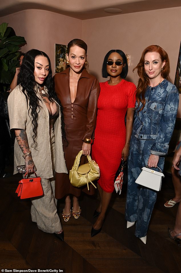 Keisha looked effortlessly chic as she arrived in a bright red figure-hugging short-sleeved Fendi dress which reached down to her knees