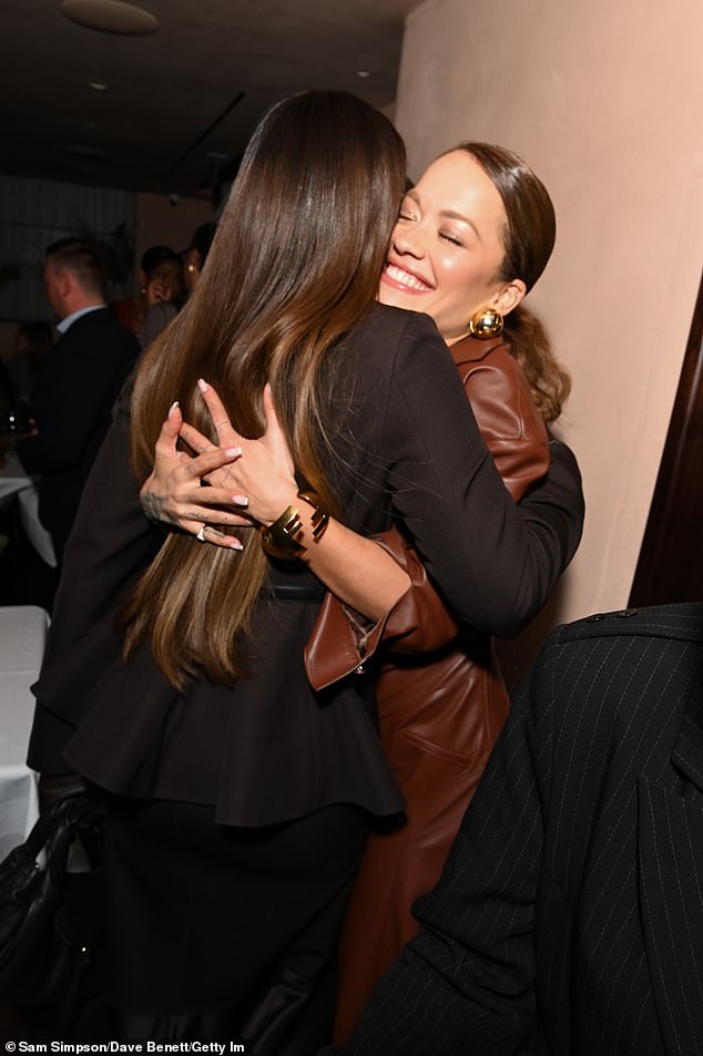 Kelly and Rita shared a sweet embrace while catching up
