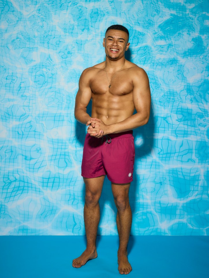 Wes Nelson from Love Island in maroon swim shorts.