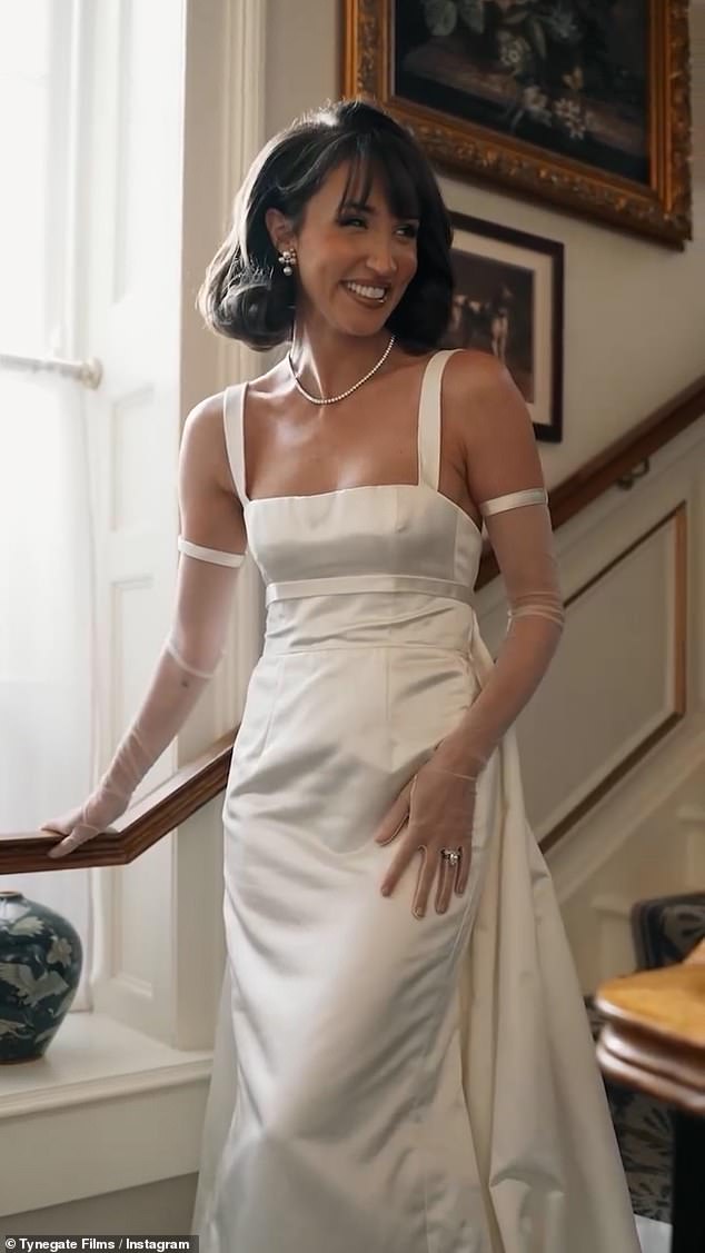 For the wedding reception, Megan slipped into a gorgeous white couture gown, complete with elegant sleeves and pearl accessories