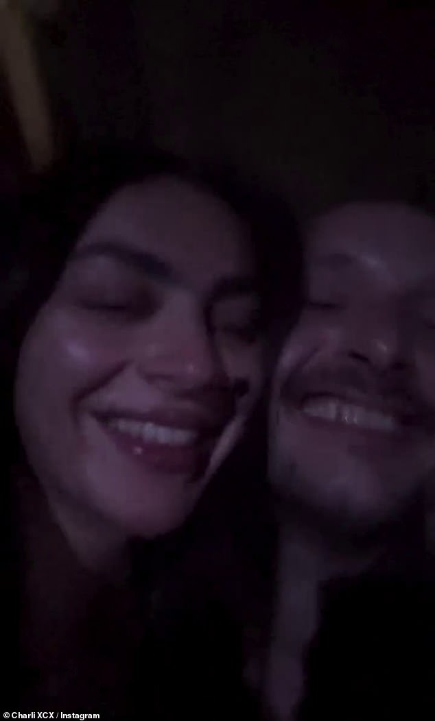 And among them was Charli, who filmed herself cosying up to fiancé George and sipping on a glass of white wine as she danced and sang along