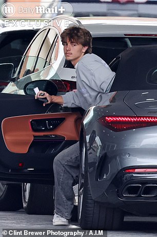 Jayden is seen with his new car
