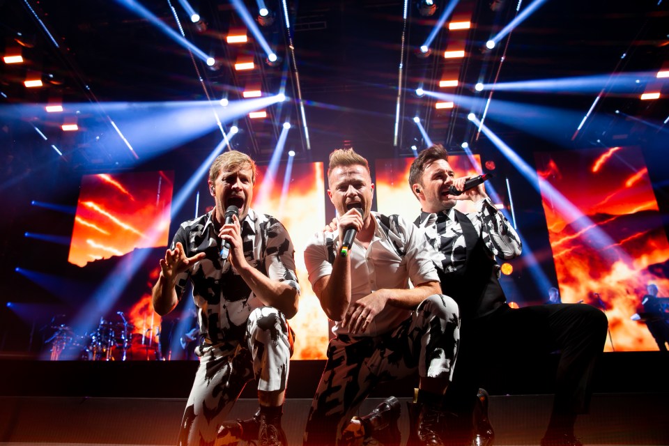 Westlife performing on stage.