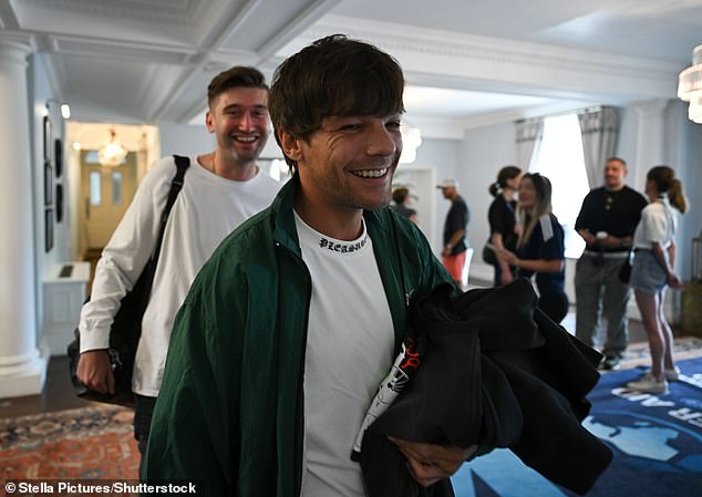 Louis walked through the hotel to the training pitch beaming