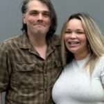 Noughties rock legend looks VERY different as he poses with pregnant YouTube star Trisha Paytas