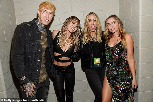 Trace Cyrus, Miley Cyrus, Tish Cyrus, and Brandi Cyrus posed backstage during the iHeartRadio Music Festival at T-Mobile Arena on September 21, 2019 in Las Vegas