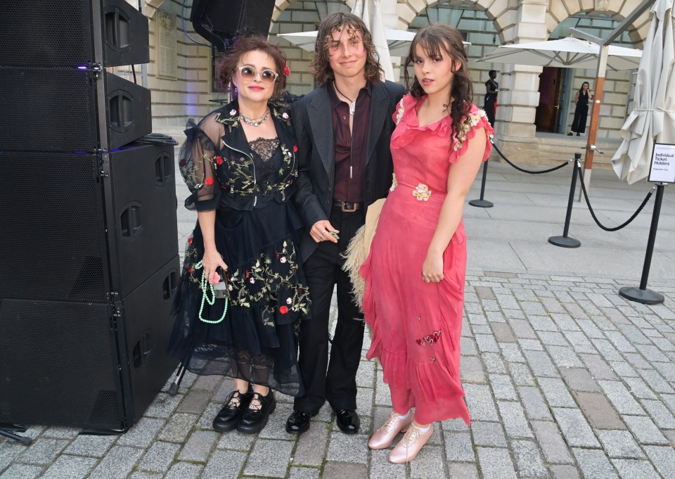 Helena Bonham Carter with her son and daughter at an event.