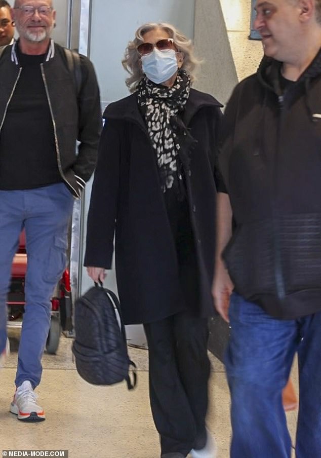 Jane looked to be in good spirits as she got out of her wheelchair to stroll through the terminal