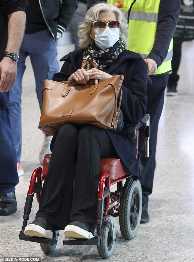 The two-time Oscar winner and former fitness queen was spotted at Sydney Airport on Friday, cutting a chic figure as she was wheeled through the terminal ahead of her highly anticipated one-off show