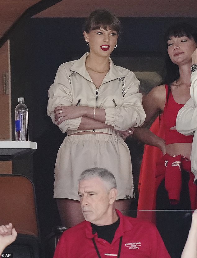 Taylor wore her sandy blonde hair in a braided ponytail and rocked her signature red lip for the big game with Travis