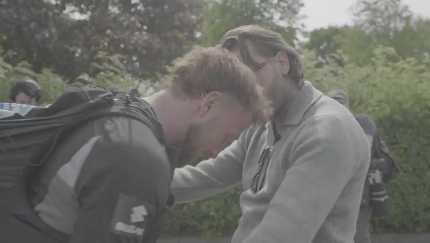 Sam Thompson visibly upset, comforted by another man.