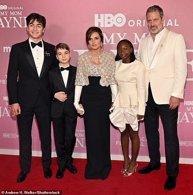 She was joined by her longtime husband, 57-year-old actor Peter Hermann (R), and their three children: L-R August, 18, Andrew, 12, and Amaya, 14