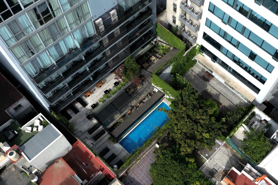 Aerial view of a hotel pool and courtyard.