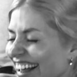 Holly Willoughby looks happier than ever as she poses in her bikini and cuddles two pals