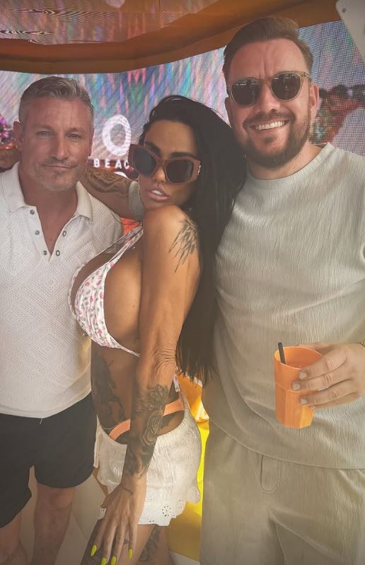 Three people posing for a photo.