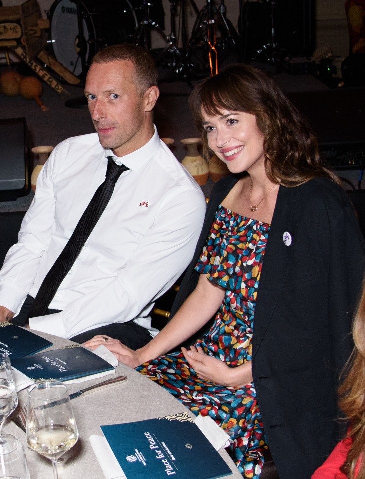 Chris Martin and Dakota Johnson at a Place for Peace event.