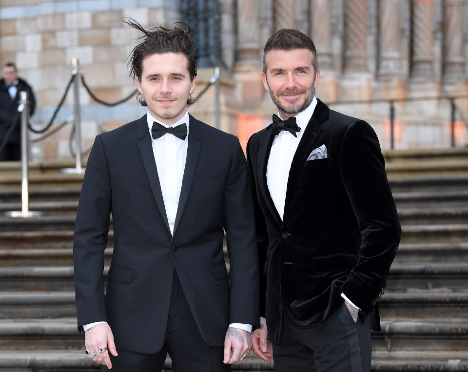 Brooklyn and David Beckham at an event.