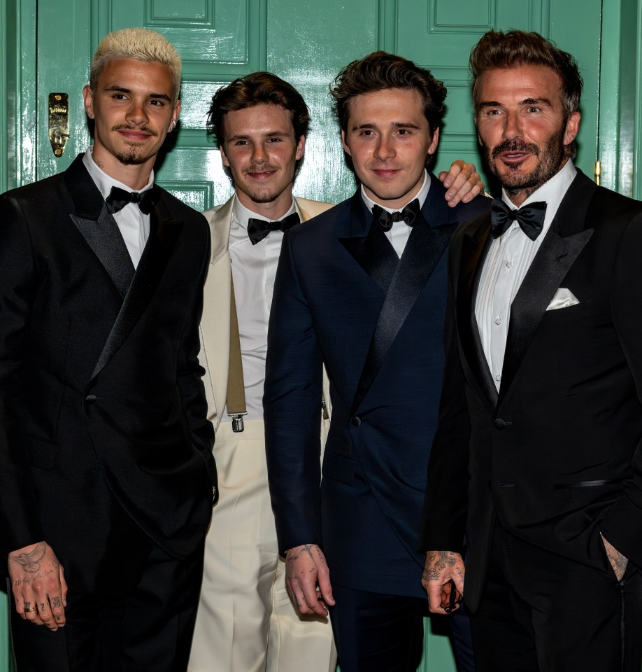 David Beckham and his three sons in tuxedos.