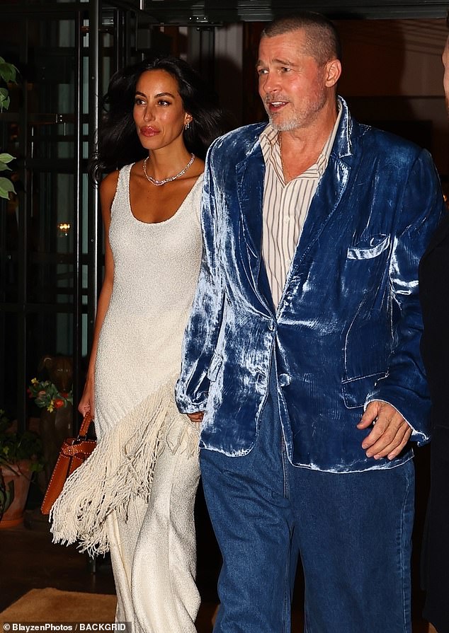 Ines put on a fashionable display in a sleeveless, white top with feathered details on the hem as well as a pair of matching trousers