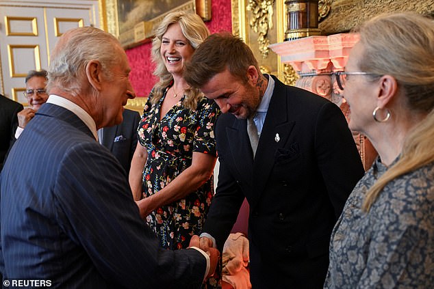The King shakes hands with David Beckham next to Penny Lancaster and Meryl Streep