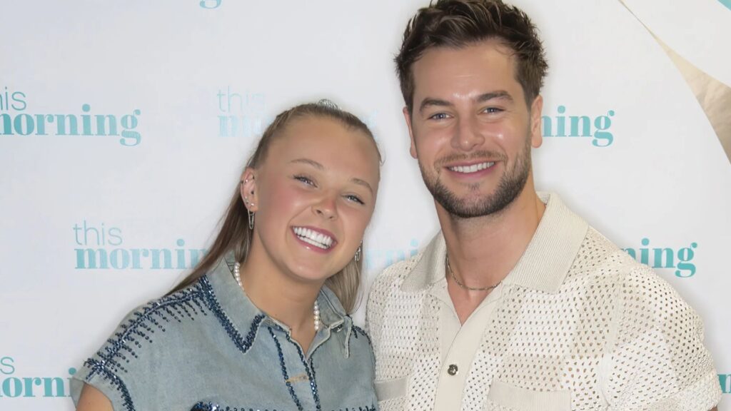 JoJo Siwa postpones US tour amid Chris Hughes romance - and drops hint she could stay longer in UK