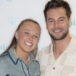 JoJo Siwa postpones US tour amid Chris Hughes romance - and drops hint she could stay longer in UK