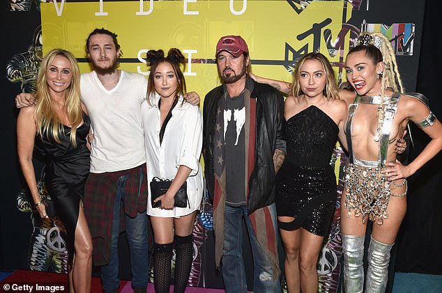 'Half of us weren't speaking to each other at one point,' Cyrus said, referencing the fallout from the 2022 divorce of her parents, Billy Ray Cyrus and Tish Cyrus. 'And we cleaned all that up.' (Pictured: Tish, Braison, Noah, Billy Ray, Brandi and Miley Cyrus in 2015).