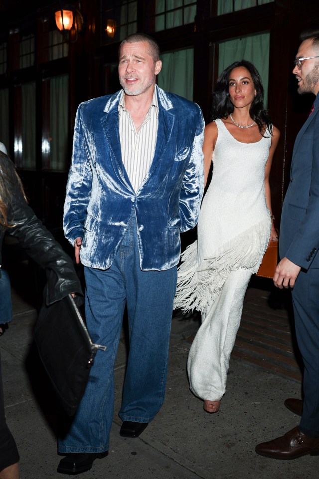 Brad Pitt and Ines de Ramon walking together in New York City.
