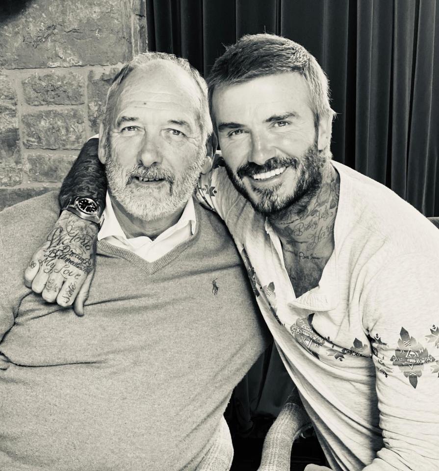 Black and white photo of David Beckham and his father.