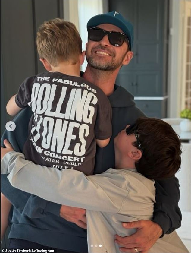 The 10-time Grammy winner also posted a rare Instagram slideshow of himself embracing little Silas and Phineas
