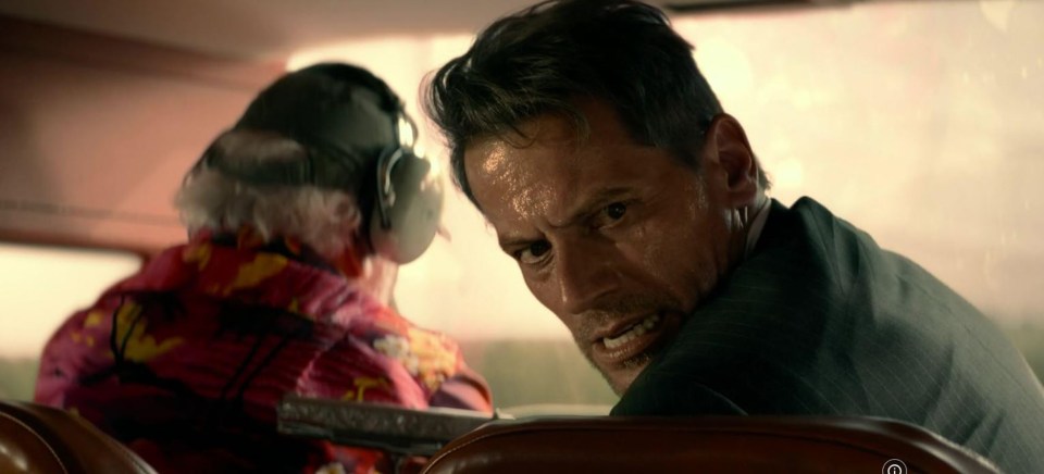Ioan Gruffudd in a plane, looking intense.