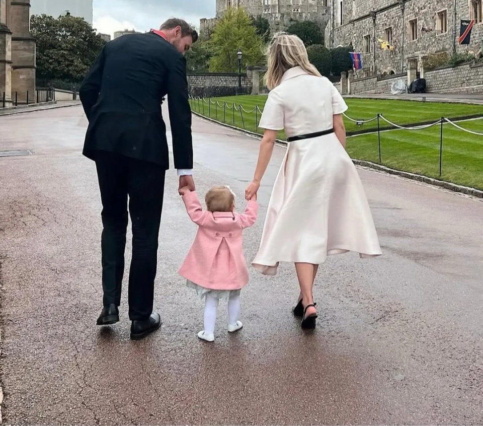 Family walking away from Windsor Castle.