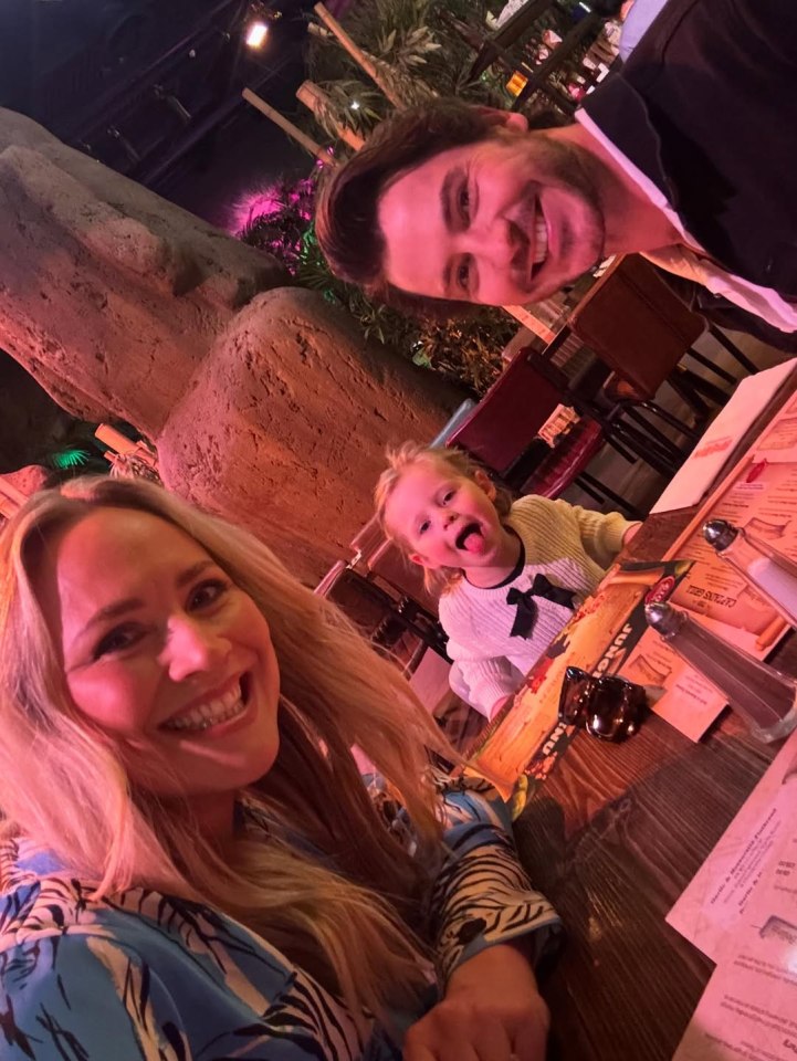 Family selfie at a restaurant.