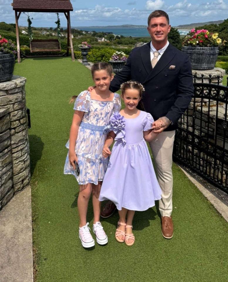 Man with two young daughters on Father's Day.