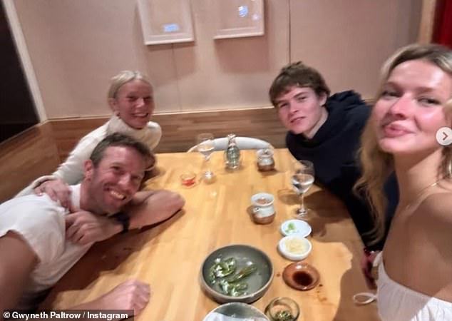 Gwyneth also posted a pictured holding hands with Chris - whom have a positive co-parenting relationship - as they enjoyed dinner with their children Apple and son Moses, 19