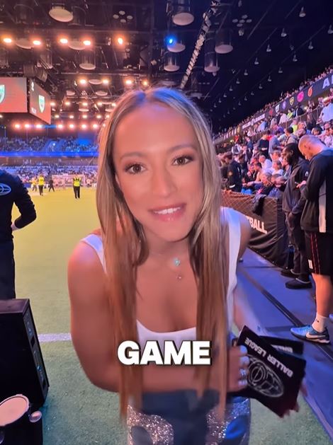 Woman at a sporting event.