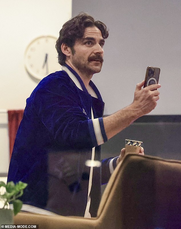 Meanwhile, Jake kept the same outfit throughout the day, slipping into a white T-shirt with black jeans and a navy jacket