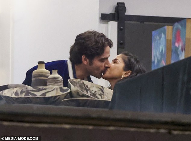 The pair looked very loved up as they perused the displays during their date night, some of which were created by Jake who is a photographer and cinematographer