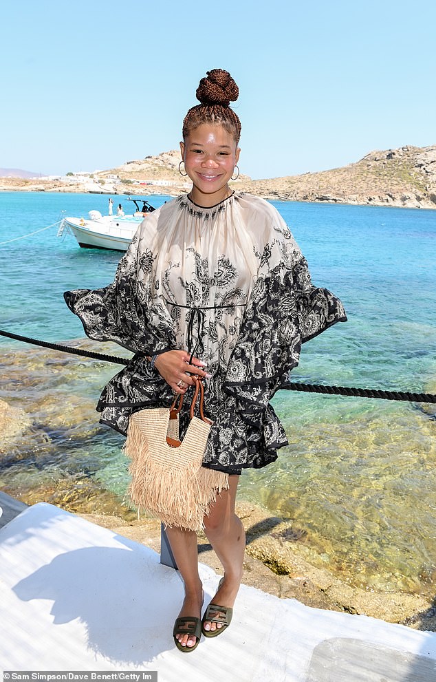 Meanwhile Storm Reid looked chic in a black and white printed layer summer dress which she paired with flip on slide sandals