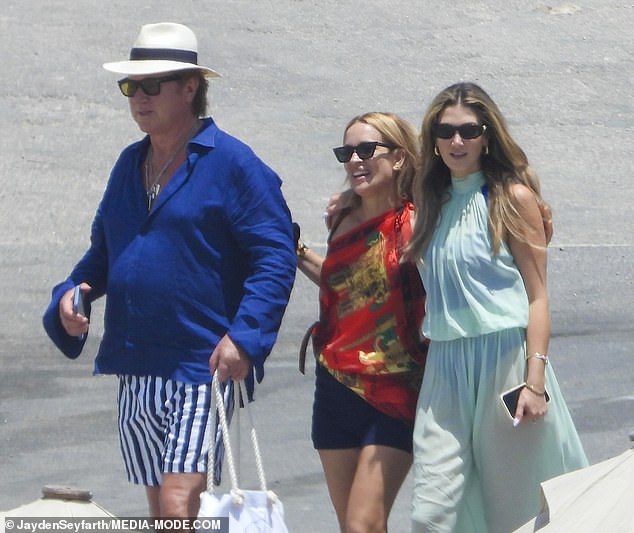 Richard Wilkins attended the bash with his girlfriend Mia Hawkswell, who was pictured walking into the party with her arm around the bride